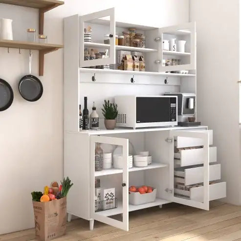 White kitchen cabinet with shelves, drawers, and a microwave.
