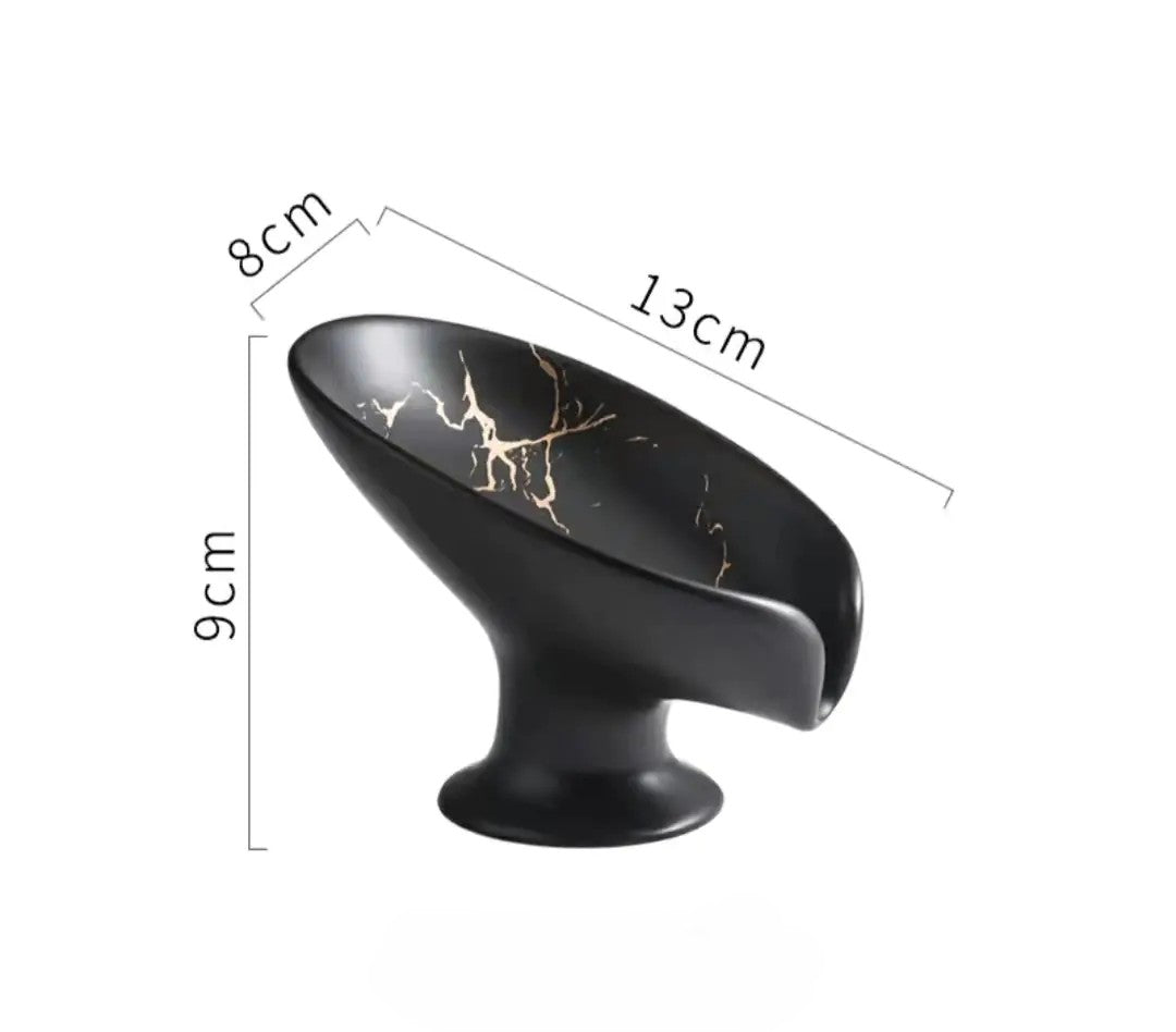 Black decorative item with gold accents and measurements on a white background