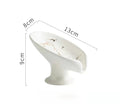 White decorative item with floral design and measurements on a white background
