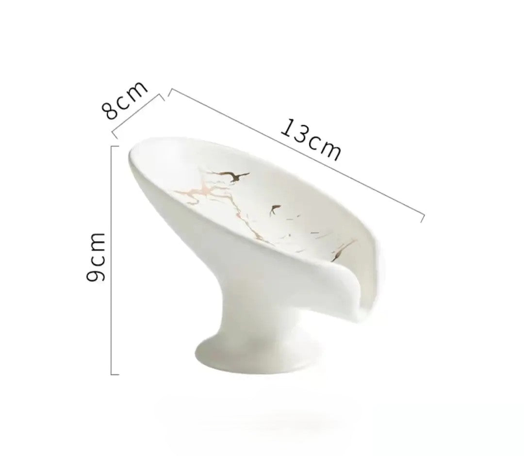 White decorative item with floral design and measurements on a white background