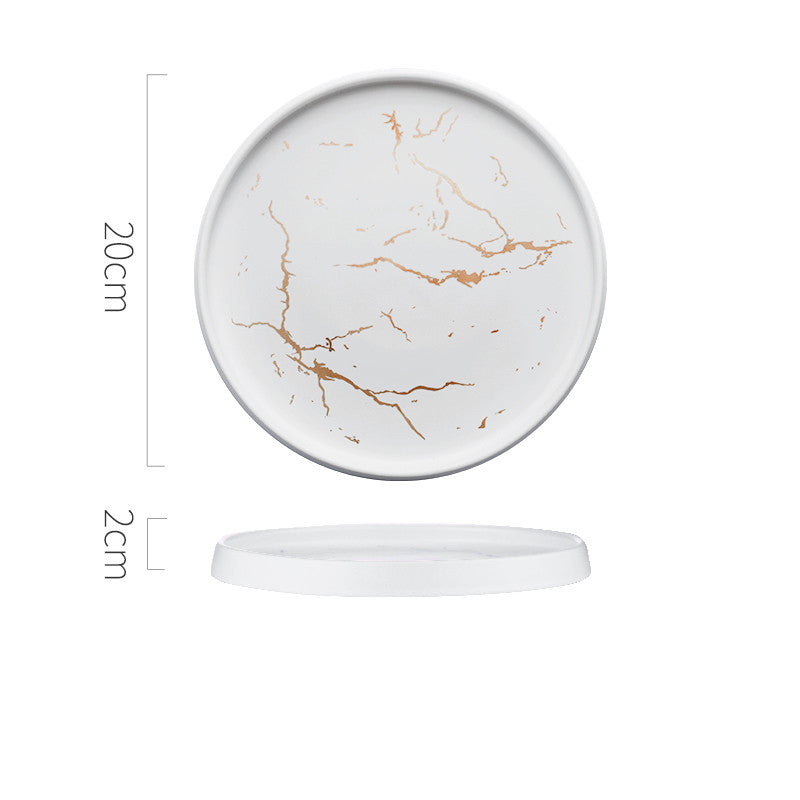 Round marble-patterned coaster with dimensions on a white background