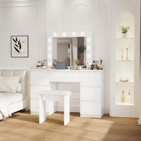 Modern bedroom with a white dresser, mirror, and stool.