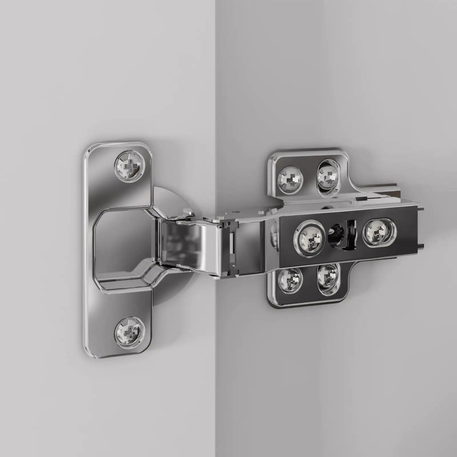 Metallic hinge attached to a gray surface